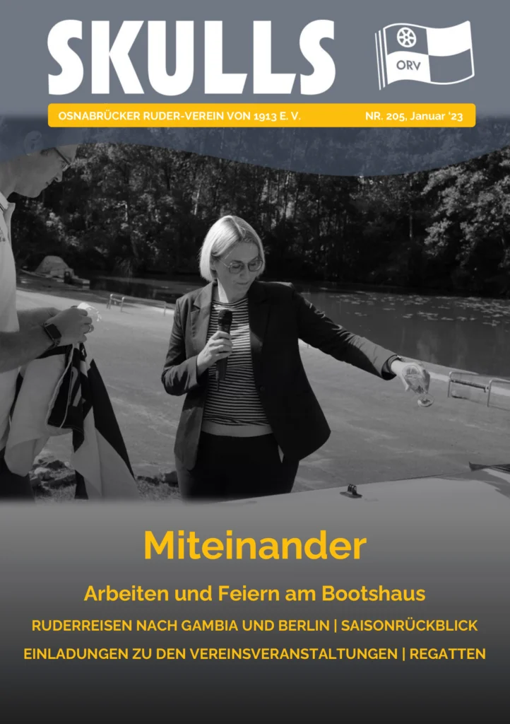 Das Magazin-Cover zeigt zwei Personen bei einer feierlichen Ansprache am Wasser, in Schwarz-Weiß gehalten.